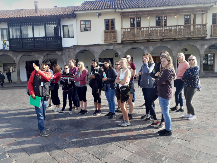 Local guide leading a Wild Free Walking Tour Cusco in the city center.
